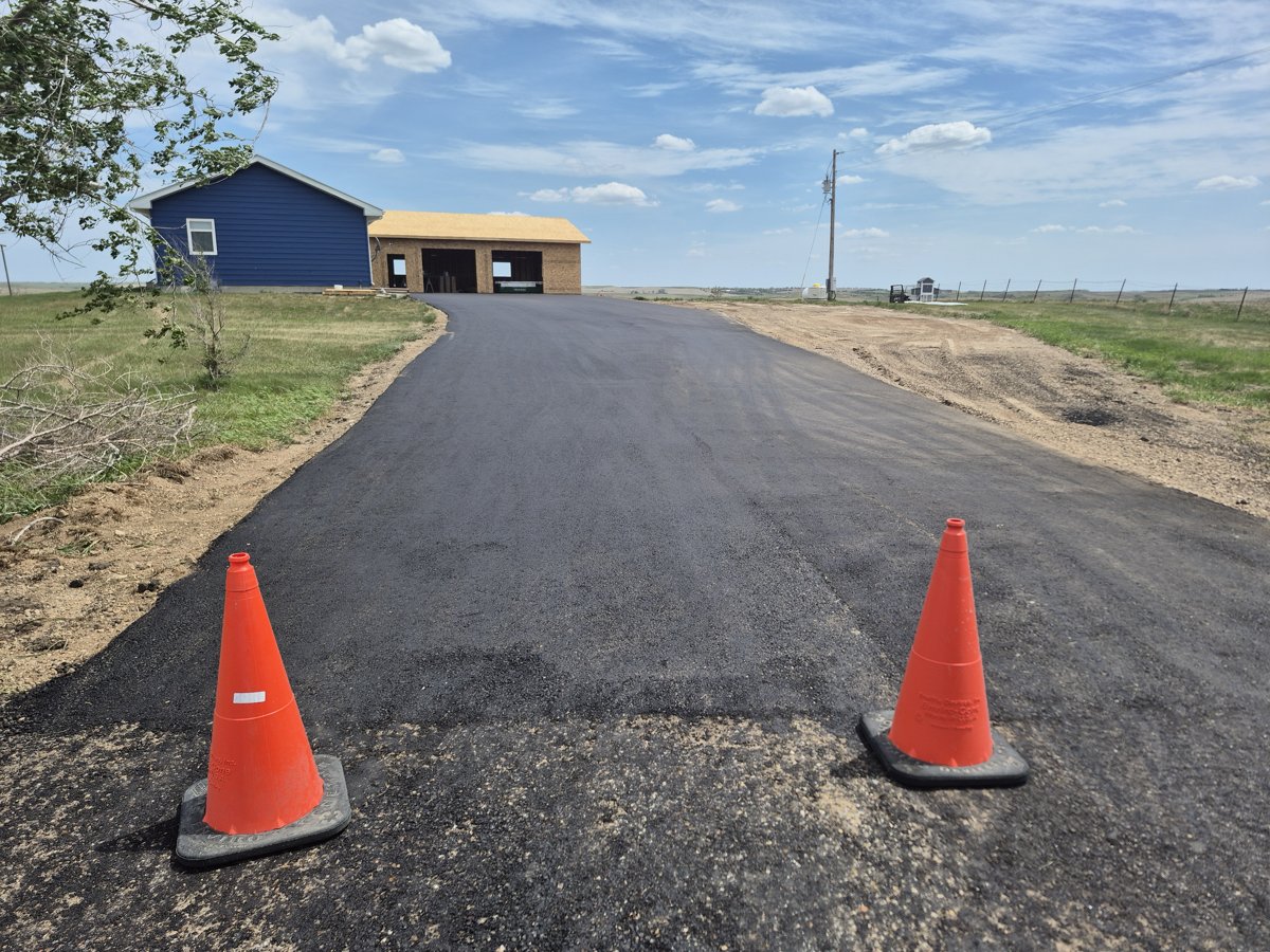 Rural asphalt driveway and approach in the Bakken region