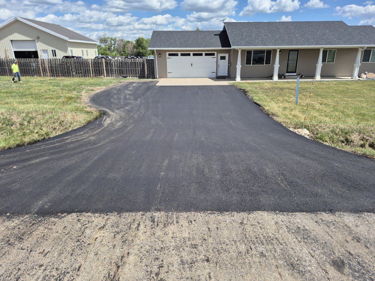 New asphalt driveway installation in the Williston Basin